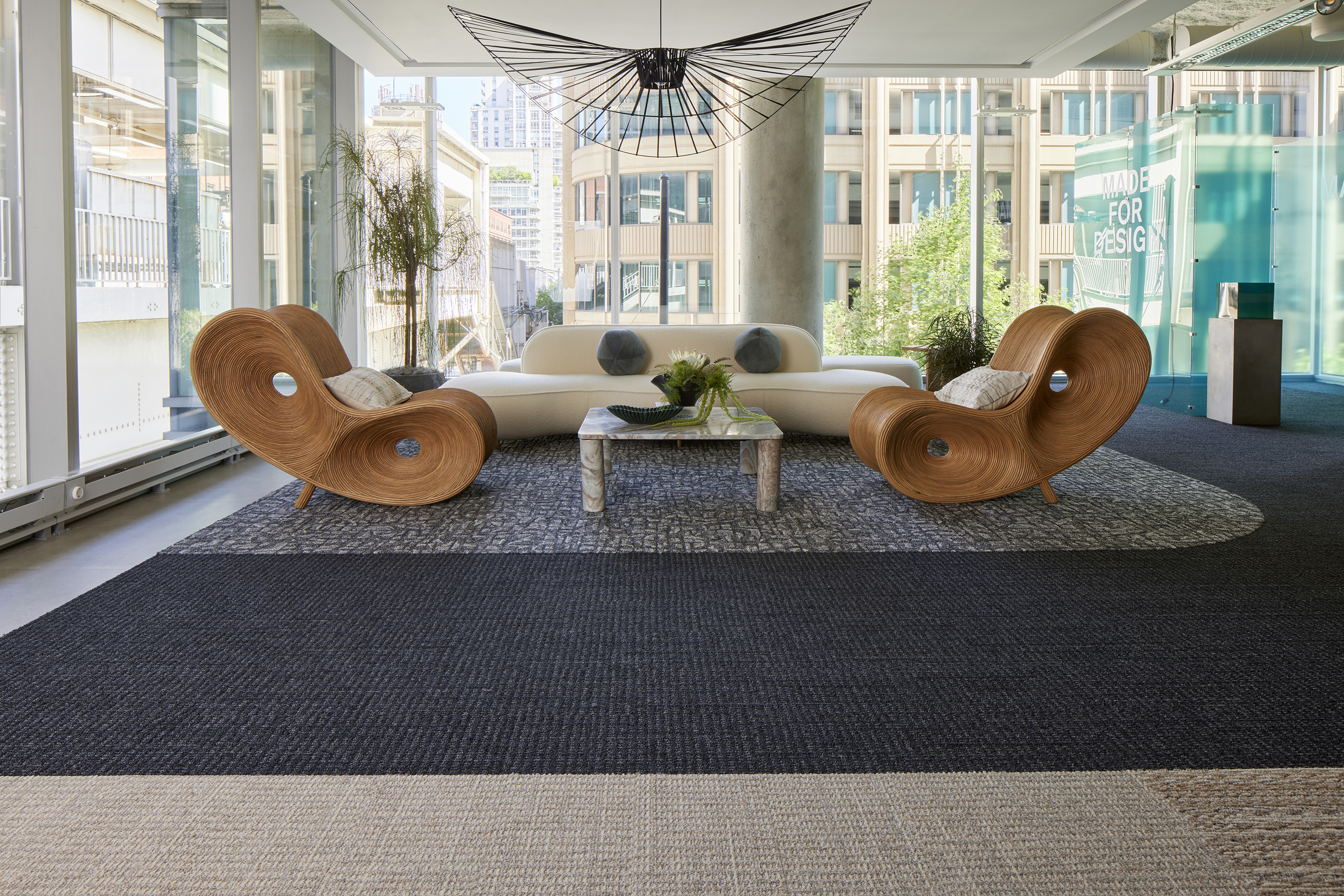 Interface E610 carpet tile with E613, E614 and E615 plank carpet tile and Hearth plank LVT in workplace seating area